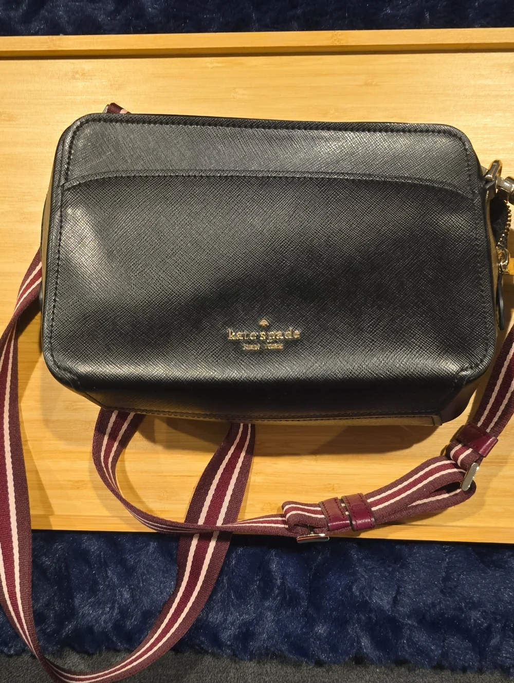 kate spade Lauryn black leather camera bag with burgundy striped strap